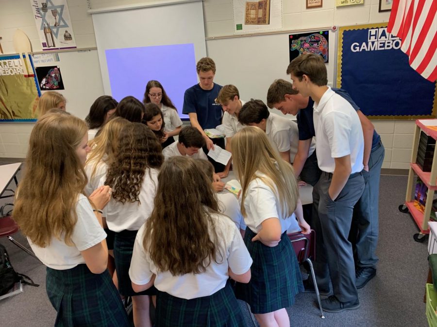 One of Dr. Liberty Halls junior theology classes plays a competitive game to learn new material. Dr. Hall and Mrs. Lindsey Farrell have completely gamified the entire  Catholicism and Major Faiths of the World course