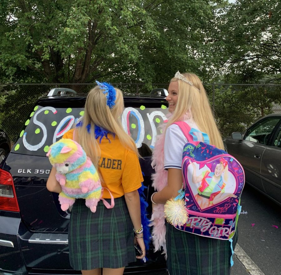Participating in an annual senior tradition, seniors Ellie Van Arkel and Parker Timmons show off their fun backpacks on the first day of school. Timmons and her friends plan on donating their backpacks to Totes 2 Tots.