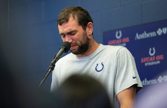 Andrew Luck becomes emotional during a press conference on August 24 announcing his retirement from the NFL.