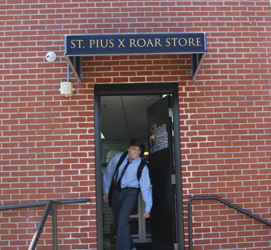 Junior RJ Brewster stealthily exits the Roar Store during his lunch period. 