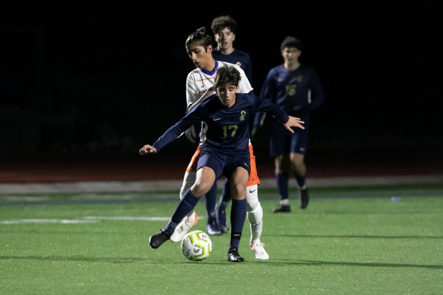 Junior Theo Jobson battles for the ball in a game against Parkview on January 30. The team began the season with a 2-1 record.