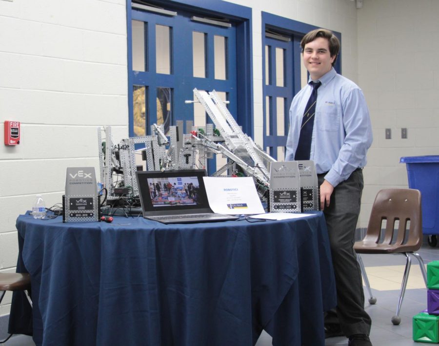 Sophomore Will Montello works at the robotics table during Open House in November. The program began five years ago, and this years RoboLions are having their most successful season ever.