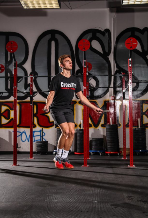 Senior Grant Sasser jumps rope at his Crossfit gym. What started out as a convenient way to stay in shape has now evolved into a passion for Sasser.