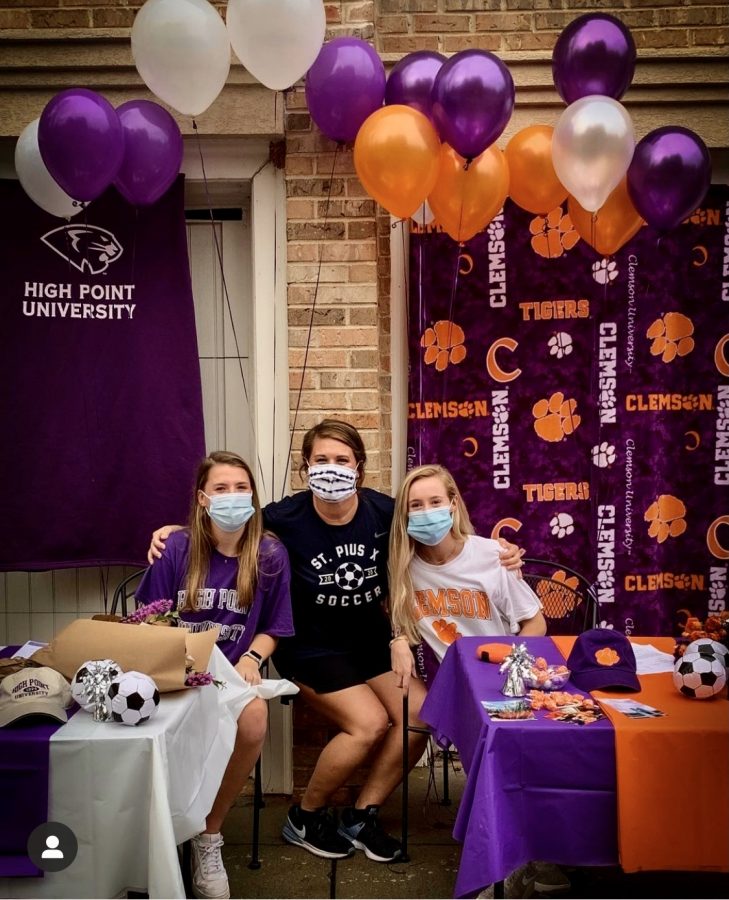 Senior Isabelle Lee (High Point University) and Renee Lyles (Clemson University) celebrate their signing day on November 11 with head soccer coach Sara Schmitt. 