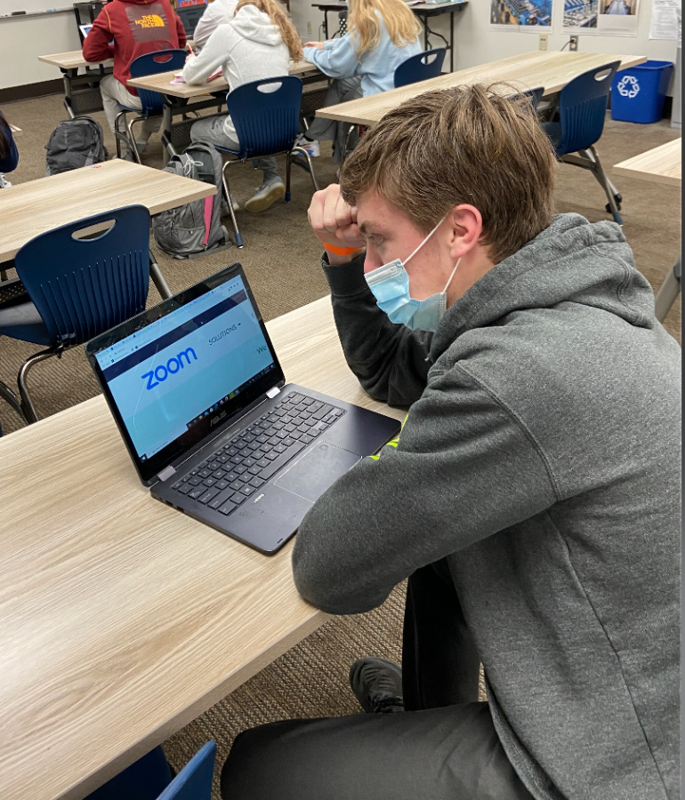 Junior Kevin Petersen demonstrates the apathy and frustration that he and most of his high school classmates encounter as a result of having to attend school on Zoom.