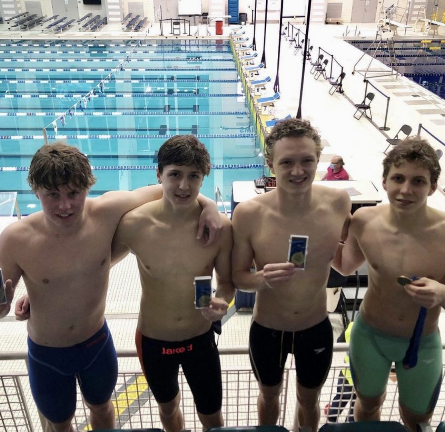 The+boys+200+Medley+Relay+team+shows+of+their+1st+place+medals+at+the+state+meet.+From+left%3A+junior+Noah+Daniels%2C+junior+Ayden+Hess%2C+senior+Henry+Halloran%2C+freshman+Zach+Sutter.
