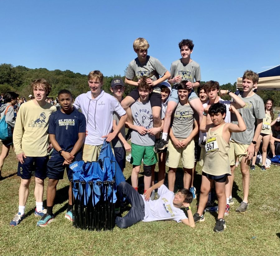 Members+of+the+boys+cross+country+team+celebrate+after+their+region+meet+on+October+27.+Both+the+varsity+and+JV+teams+placed+second.+While+some+of+the+runners+lead+the+pack+and+have+aspirations+to+run+in+college+or+set+a+school+record%2C+others+simply+enjoy+being+part+of+a+team+and+proving+something+to+themselves+regardless+of+their+finish+times.+