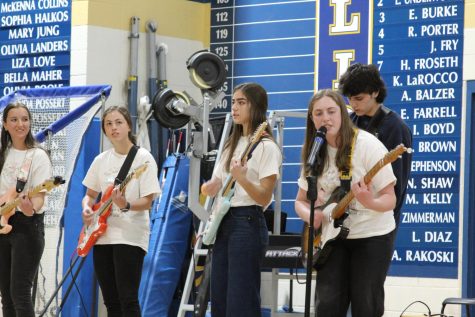 Advanced guitar students perform at the Fine Arts Assembly in March.