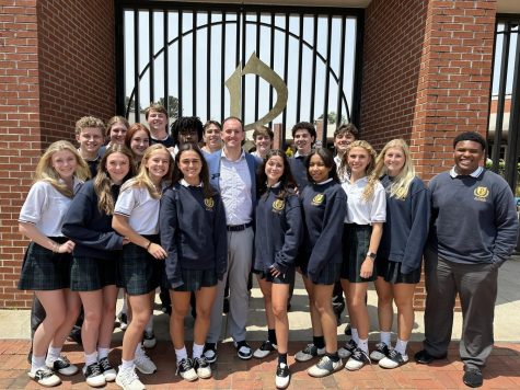 Mr. Aaron Parr and members of the Class of 2023 celebrate in front of the school gates on Friday, April 21 after he was officially announced as the next St. Pius X President.
