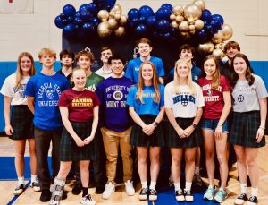 A group of seniors take a picture after their signing day in April. Seniors also signed letters of intent on signing days in Novembe and February.