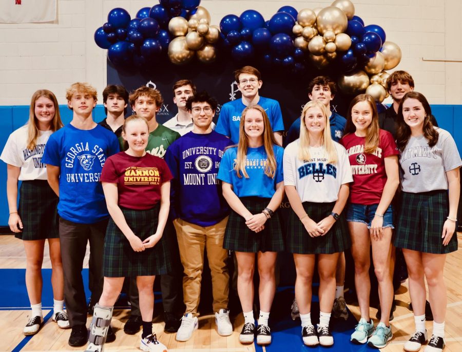 A+group+of+seniors+take+a+picture+after+their+signing+day+in+April.+Seniors+also+signed+letters+of+intent+on+signing+days+in+Novembe+and+February.