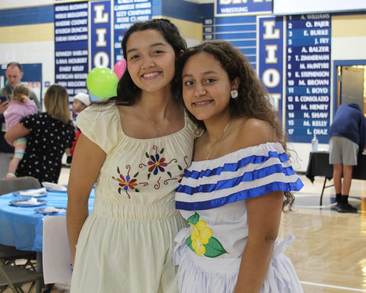 Seniors Luna Ochoa and Georgia Guadamuz wear traditional dresses from Guatemala and Nicaragua, respectively, at last years Heritage Homecoming. 