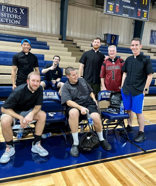 The priest basketball team reflects on their loss after the students beat them 11-10 in a basketball game on Wednesday, November 8 as part of National Vocations Awareness Week. Staff photo