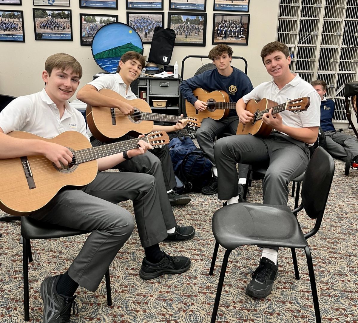 Students in Advanced Guitar prepare for Morning of the Arts on November 15. They will perform at their annual Christmas concert with the Band program on December 7. Theater and Chorus will have their show on December 6 followed by Dance on December 7. Staff photo.