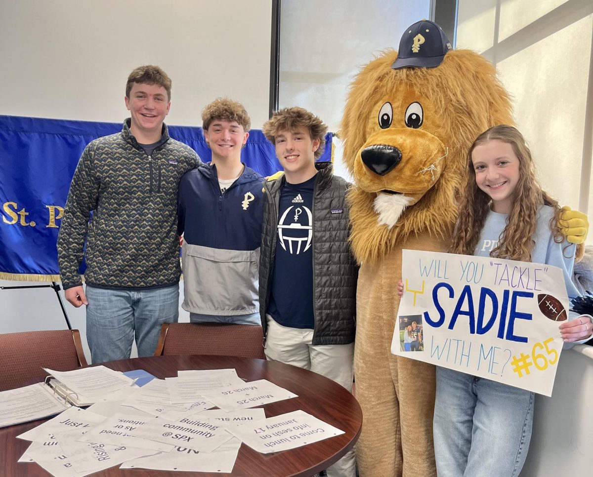 During the live announcements on Friday, January 5, junior Lydia Halloran asks junior Jackson Neil (third from left) to the Sadie Hawkins Dance. Student Council had the idea to bring back the traditional dance for the first time in several years. It is on Saturday, January 20 from 7:00-9:00 pm, and tickets are still available to purchase.