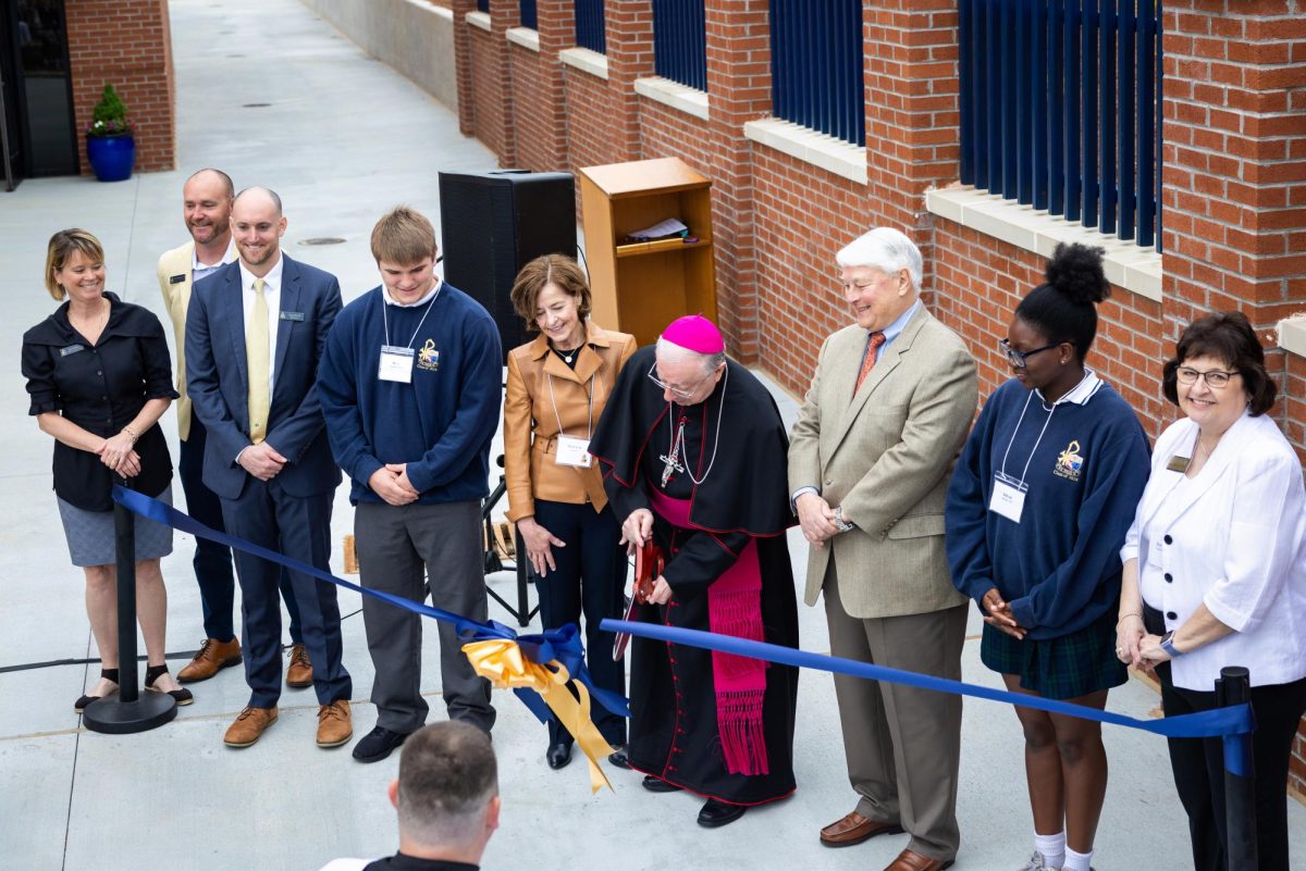 Bishop Joel Konzen and other key leaders of the Ring the Bells Campaign participate in a ribbon cutting ceremony for the St. Joan of Arc Field House on April 16. Photo courtesy of Art of Life