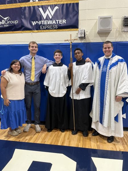 New Director of Campus Ministry Ms. Miranda Contreras (far left), Mr. Liam Byrne, and chaplain Fr. Robbie Cotta get ready to celebrate the first-all school Mass of the year in August.