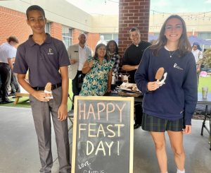 Sophomore Ben Nash and Junior Ashley Baldwin enjoy ice cream at lunch of the feast day of St. Pius X