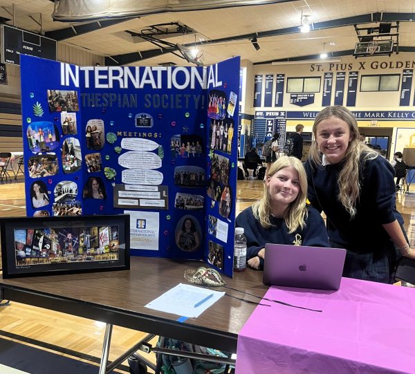 Seniors Libbie Brownlow and Savannah Stone represent the International Thespian Society at Club Sign-Up Day in August.