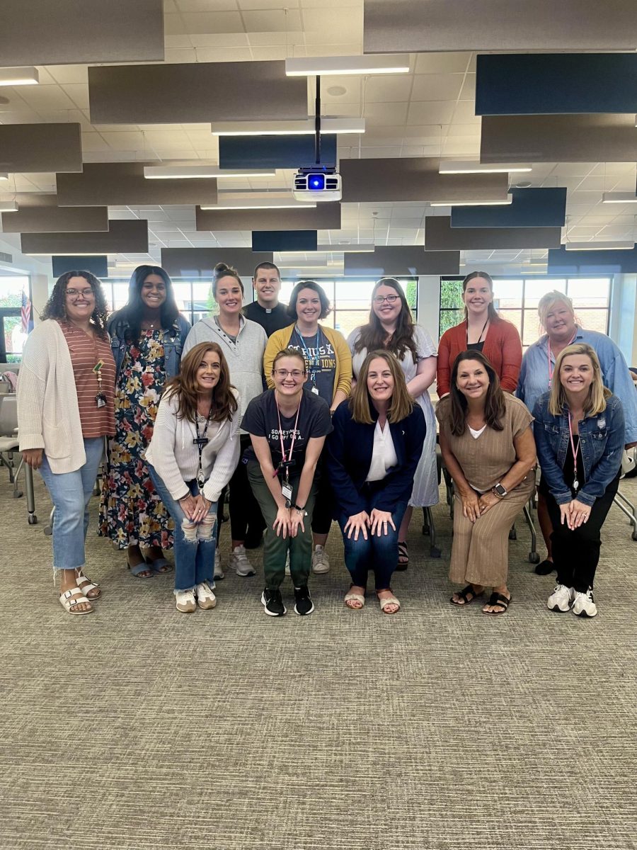 The newst group of teachers and staff get together for a picture in the library during pre-planning in August.