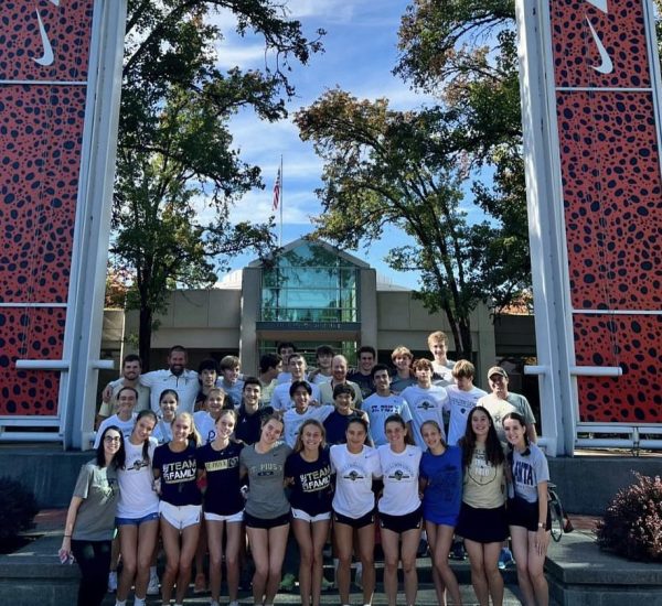 The cross country teams stand outside of Nike Headquarters after touring the campus.