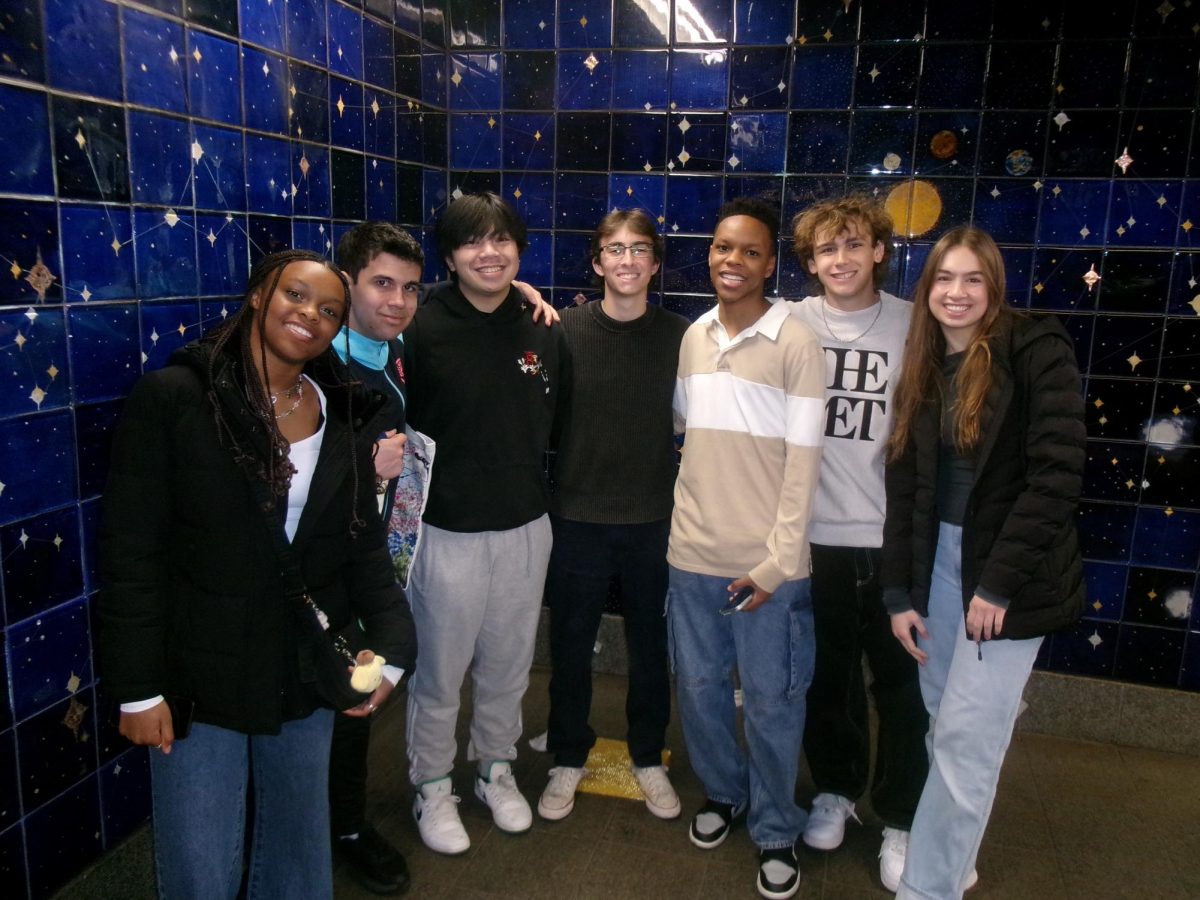 Senior members of Model UN take a picture while waiting for the subway after visiting the MET. The group attended a Model UN conference in March that had more than 3,000 attendees from all over the world. Photo courtesy of Katie Swartz '25