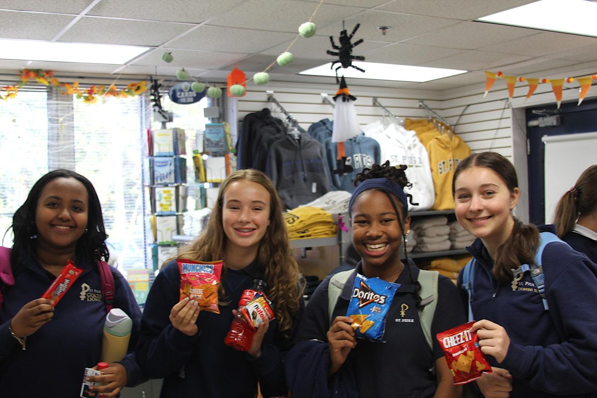 Freshmen Navi Herb, Elizabeth Clark, Kylie Stocks, and Leah Alemayehu visit the Roar Store during their lunch period.