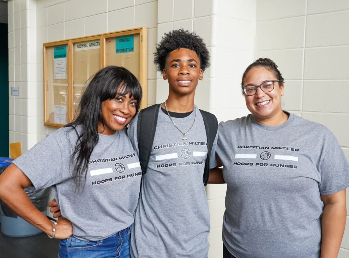 Junior Christian Milteer hosted Hoops for Hunger in October, a 3v3 basketball tournament that collected money and food for the Roswell community. Pictured with Christian are his mom (left) and St. Pius X science teacher Mrs. Luz Dominguez. Photo courtesy of Mrs. Dominguez