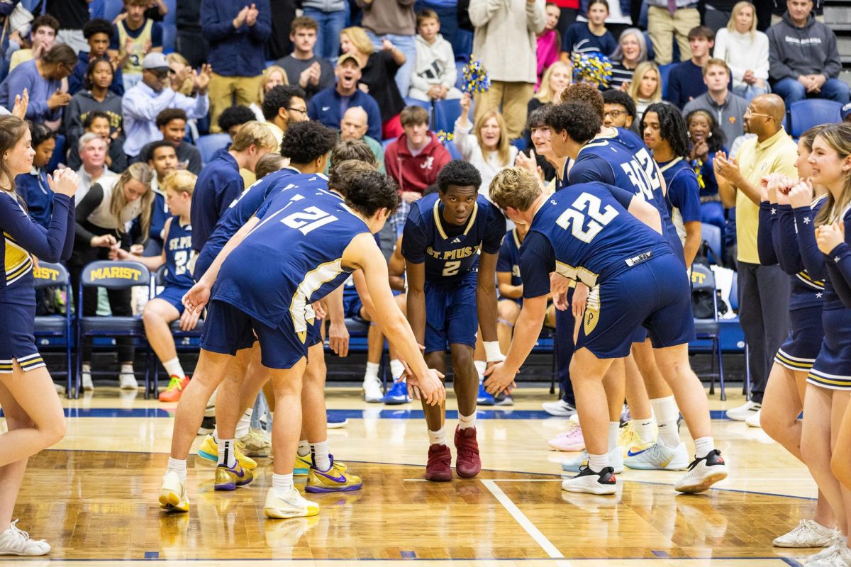 Senior Harris Reynolds takes the court during player inttroductions before a game against Marsit. Reynolds, a 4-star Clemson commit, and his teammates are currently 26-0, the best record in school history.
