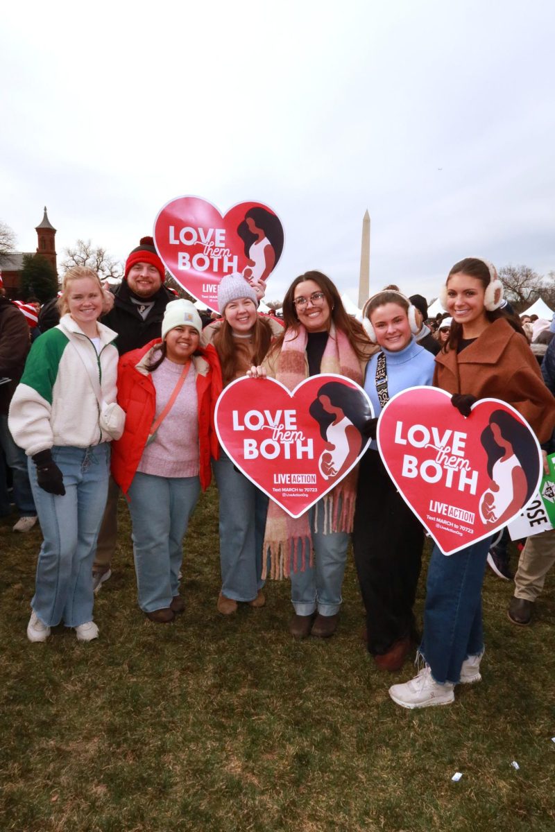 A group of seniors take a picture during  the March for Life with Mr. Christopherson, Ms. Contreras, Ms. Campbell, and Ms. Kriscovich. Photo Courtesy of Josza Acosta