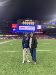 Stephen Jacon takes a picture with SPX athletic trainer Schmitty after a New England Patriots game this winter. Jacon serves as an athletic trainer for the Patriots. Photo courtesy of Schmitty.